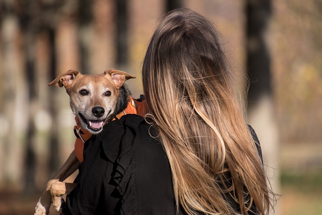 a woman holding her dog