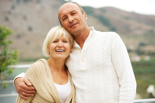 a man and a woman posing for a picture